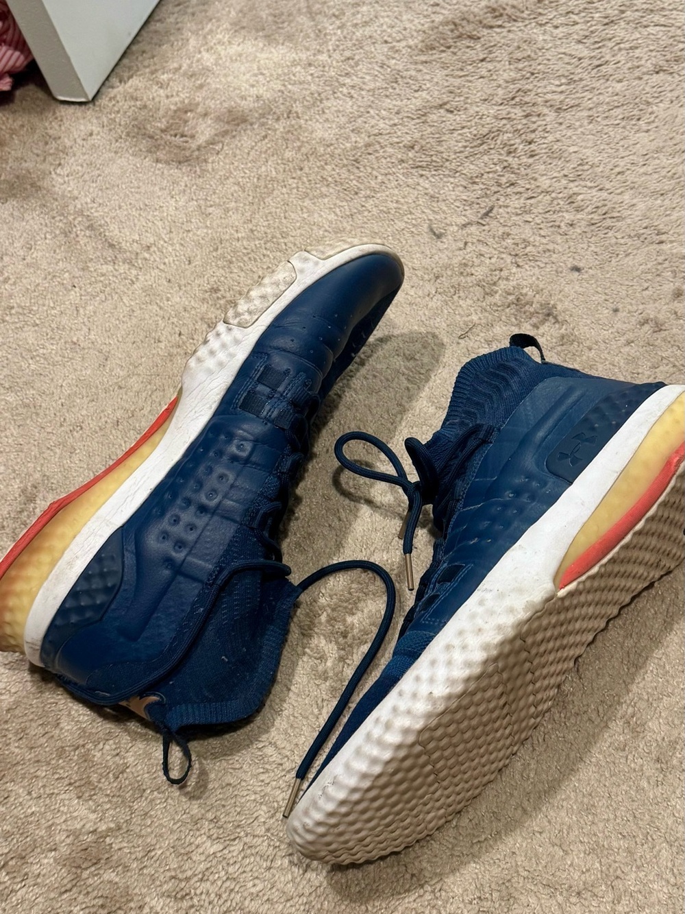 The Rock x Under Armour Navy and White Training Shoes with Orange Heel Accent